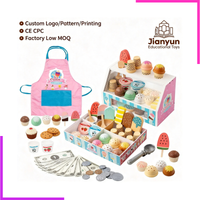 Tout le contenu du coffret étalé : tablier, comptoir, glaces, billets et pièces