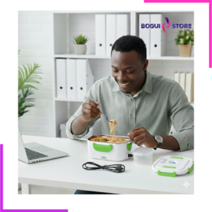 Lunch box chauffante électrique blanche et verte Bogui Store posée sur un bureau, avec son câble d'alimentation noir plié et son couvercle hermétique à côté